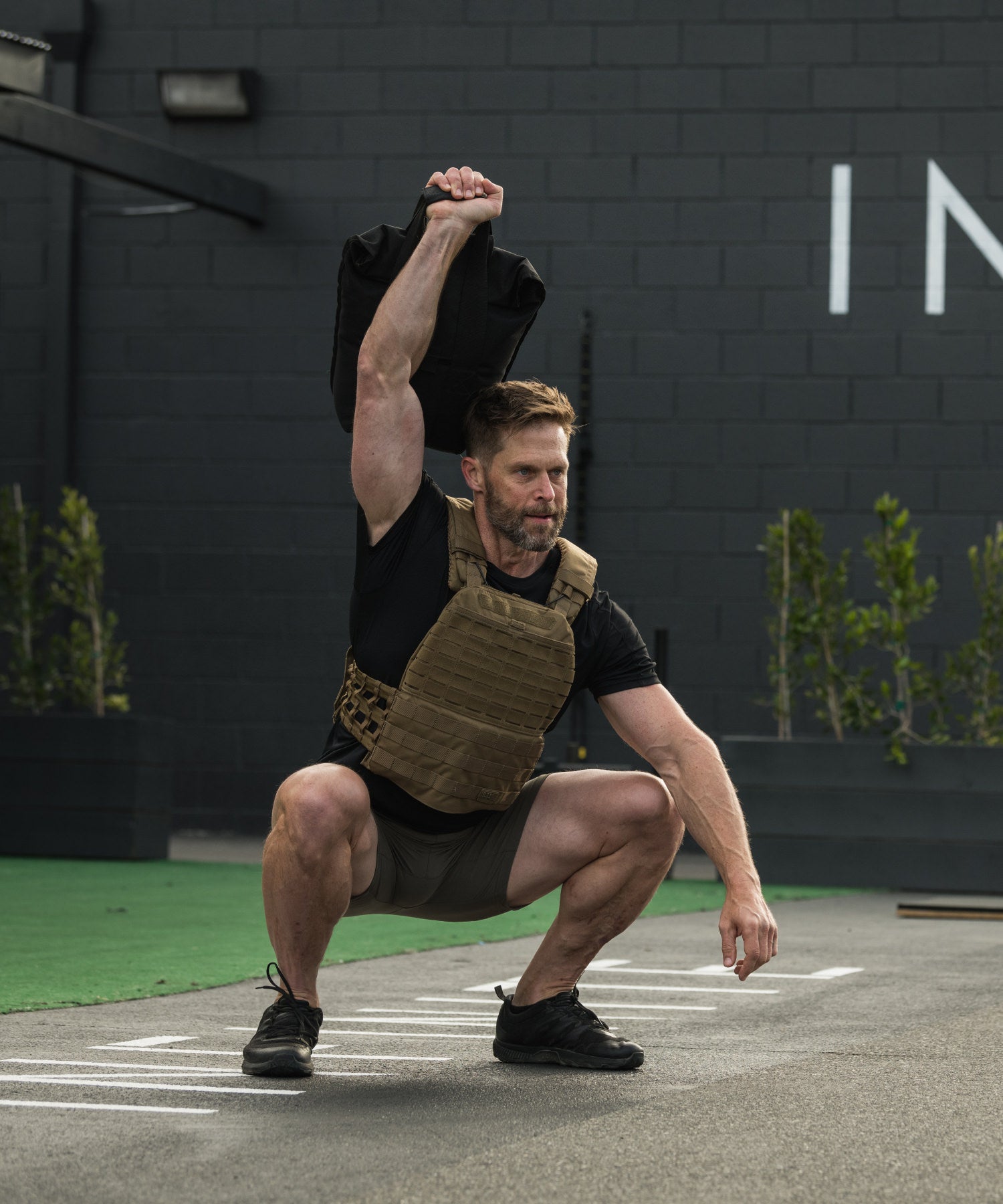squat con peso eseguiti con pt-r weight 100