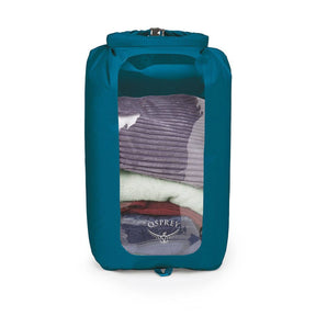 Sacca stagna ultraleggera Osprey Ultralight Dry Sack W/ Window in diverse capacità), con chiusura roll-top impermeabile e finestra trasparente per l'identificazione rapida del contenuto, disponibile nei colori blu petrolio (Waterfront Blue), arancione (Mars Orange) e nero