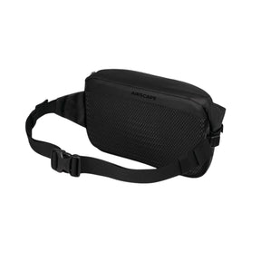 Osprey Transporter Waist Pack marsupio da 3 litri realizzato in tessuto tecnico con trama a griglia e logo frontale, dotato di tasca esterna con zip, cinghie di compressione laterali e cintura regolabile con fibbia a scatto per escursionismo e tempo libero.