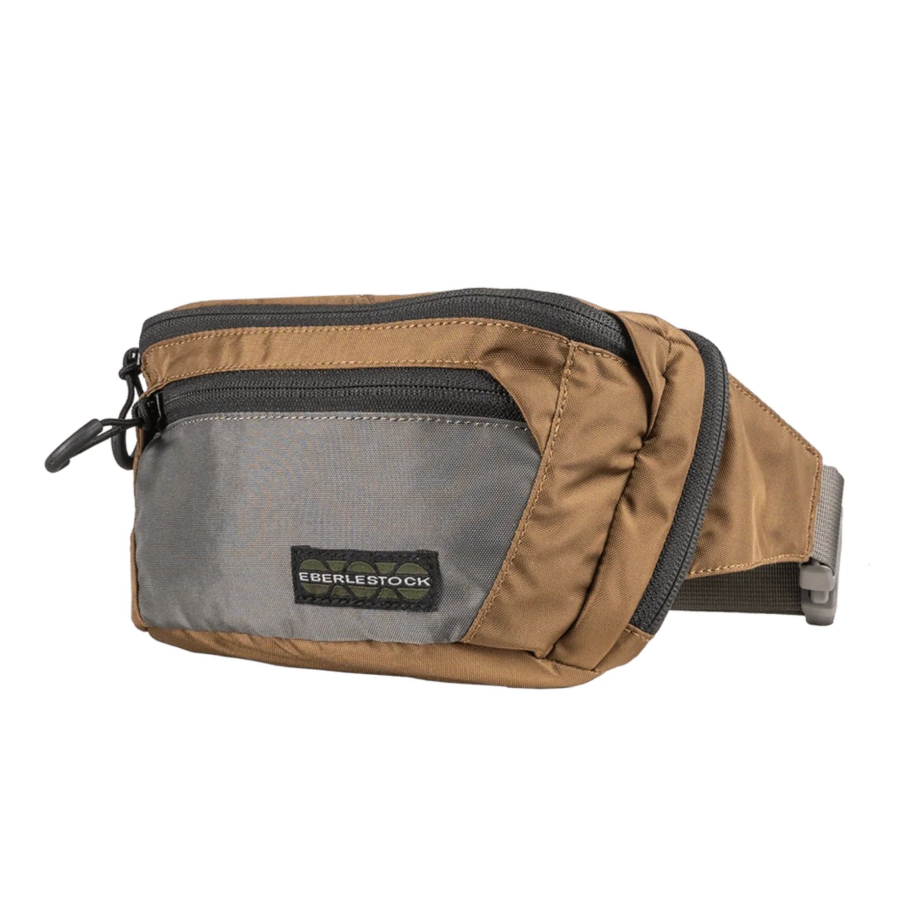 Eberlestock Bando Bag Marsupio tattico low-profile per EDC e porto occulto. Design discreto con tasca posteriore dedicata ad accesso rapido per arma e scomparto principale organizzato. Include passante per laccio emostatico. Soluzione versatile per sicurezza personale e urban carry. 2 misure.