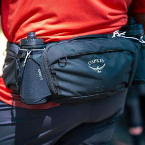 Osprey Savu 5 cintura da ciclismo con capacità 5 litri e tasche per borracce a scomparsa. Marsupio ergonomico per mountain bike con schienale traspirante AirScape e ampi scomparti per attrezzi e snack, ideale per escursioni e trail.