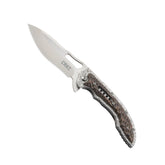 CRKT Fossil coltello chiudibile con apertura flipper su cuscinetti a sfera IKBS, lama drop point in acciaio 8Cr13MoV, guancette con lavorazione martellata e clip da tasca, robusto e versatile per uso EDC, campeggio e attività outdoor.