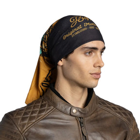 Buff Original EcoStretch Neckwear CIFE MULTI scaldacollo tubolare multifunzione con protezione solare. Dettaglio del tessuto tecnico elasticizzato riciclato con grafica ispirata ai profili montuosi delle Dolomiti, posizionato in verticale su sfondo bianco per catalogo e-commerce.