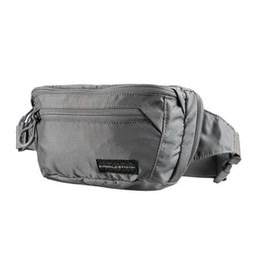 Eberlestock Bando Bag Marsupio tattico low-profile per EDC e porto occulto. Design discreto con tasca posteriore dedicata ad accesso rapido per arma e scomparto principale organizzato. Include passante per laccio emostatico. Soluzione versatile per sicurezza personale e urban carry. 2 misure.