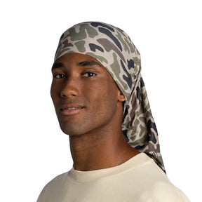 Buff Coolnet UV Neckwear BLAX KHAKI scaldacollo multifunzionale con protezione solare UPF 50+ ideale per attività all'aperto, corsa e trekking. Fascia elastica traspirante senza cuciture con logo visibile, perfetta per lo sport in estate.