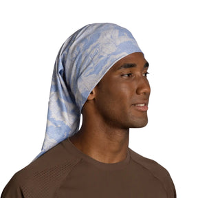 Buff Coolnet UV Neckwear LOER GLORY BLUE scaldacollo multifunzionale con protezione solare UPF 50+ ideale per attività all'aperto, corsa e trekking. Fascia elastica traspirante senza cuciture con logo visibile, perfetta per lo sport in estate.