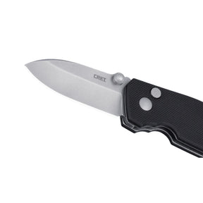 CRKT Squid Button Lock 2474 coltello chiudibile EDC con lama drop point stonewash, thumb stud per apertura rapida, meccanismo di sicurezza button lock e impugnatura ergonomica testurizzata con foro per cordino, ideale per escursionismo e outdoor.
