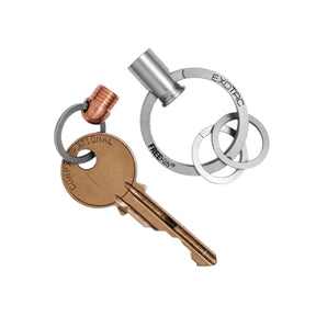 Exotac BMQR .380 Portachiavi a sgancio rapido magnetico con corpo in rame e acciaio inossidabile. Accessorio EDC compatto per organizzazione chiavi con attacco sicuro e design ispirato ai bossoli.