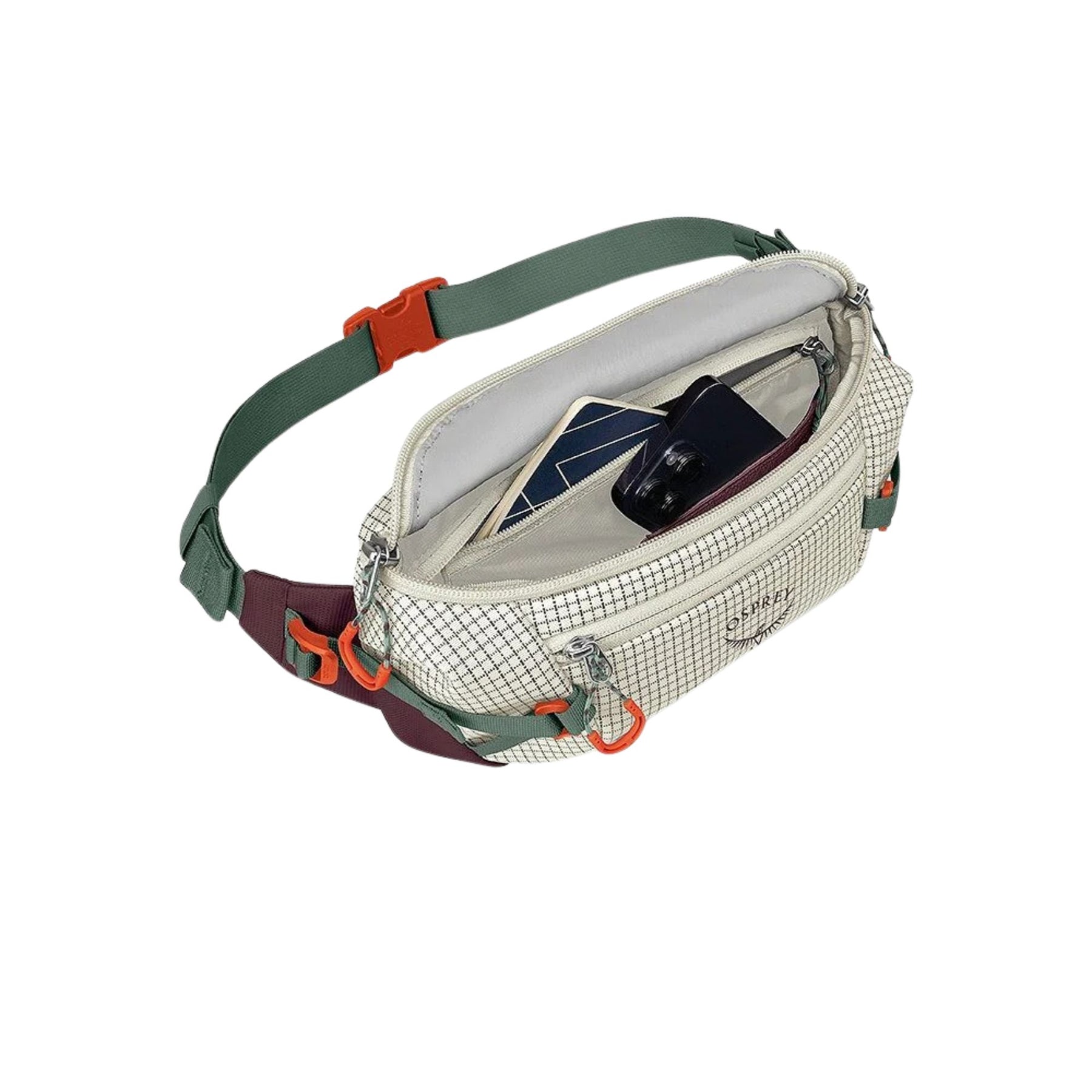 Osprey Transporter Waist Pack marsupio da 3 litri realizzato in tessuto tecnico con trama a griglia e logo frontale, dotato di tasca esterna con zip, cinghie di compressione laterali e cintura regolabile con fibbia a scatto per escursionismo e tempo libero.
