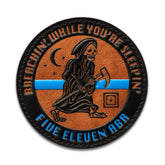 5.11 Breachin' While You're Sleepin' Patch, toppa circolare in similpelle arancione e nera, con il Tristo Mietitore che porta un'ascia , scritta Five Eleven ABR e linea blu Thin Blue Line