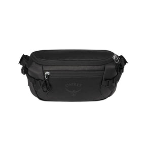 Osprey Transporter Waist Pack marsupio da 3 litri realizzato in tessuto tecnico con trama a griglia e logo frontale, dotato di tasca esterna con zip, cinghie di compressione laterali e cintura regolabile con fibbia a scatto per escursionismo e tempo libero.