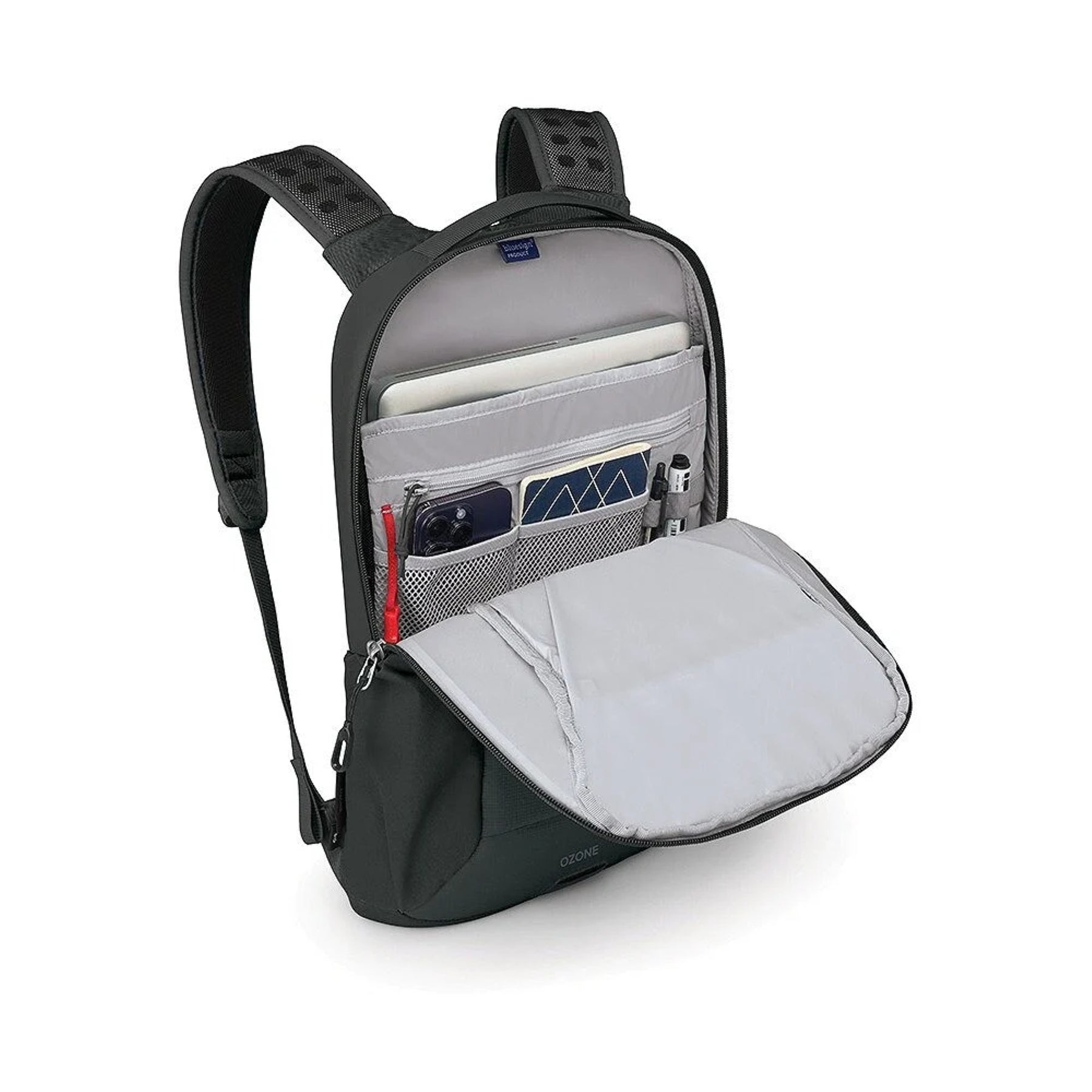 Osprey Ozone Slim Pack: Zaino da viaggio ultra-compatto da 10 litri con profilo sottile. Progettato per l'organizzazione essenziale, dispone di scomparto per laptop fino a 16 pollici e schienale AirScape traspirante. Realizzato in nylon riciclato ad alta resistenza.