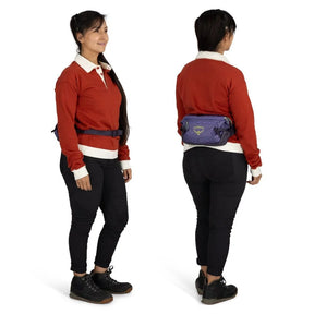 Osprey Transporter Waist Pack marsupio da 3 litri realizzato in tessuto tecnico con trama a griglia e logo frontale, dotato di tasca esterna con zip, cinghie di compressione laterali e cintura regolabile con fibbia a scatto per escursionismo e tempo libero.